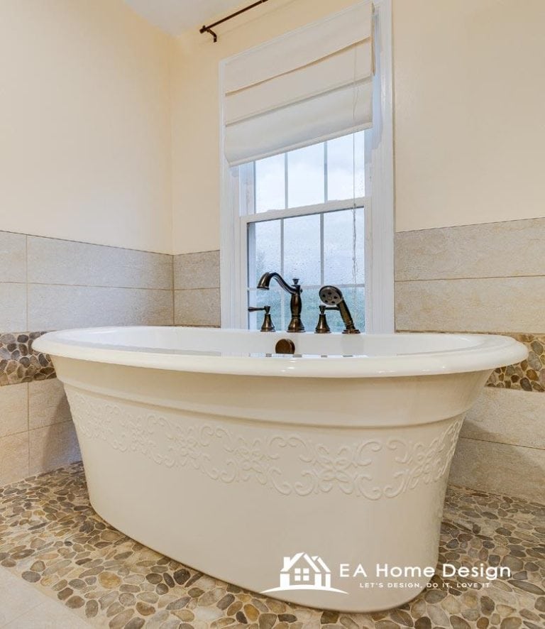 Modern bathroom with walk-in shower and soaking tub, featuring natural stone accents and elegant fixtures.