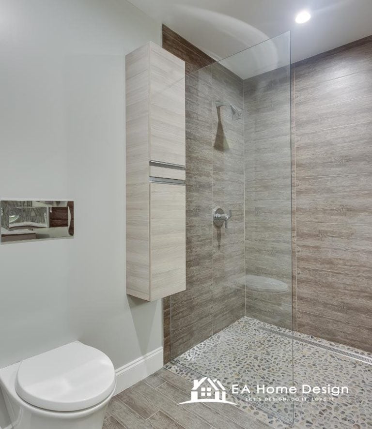 Contemporary bathroom interior with modern vanity and stylish glass block accent wall.