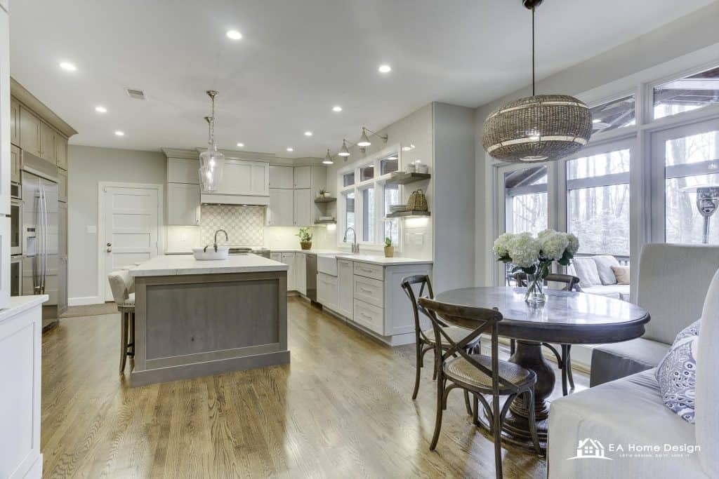 Dining area with checkered tablecloth, metal chairs, and kitchen view.