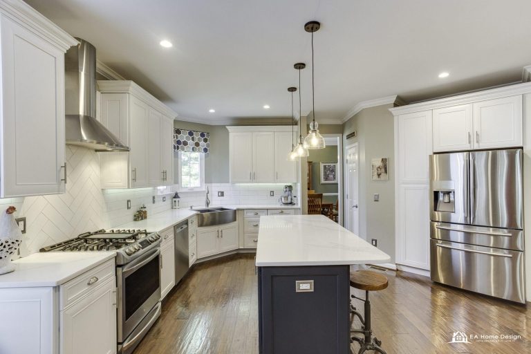 Luxury kitchen interior showcasing high-end cabinets, stone countertops, and ambient lighting.