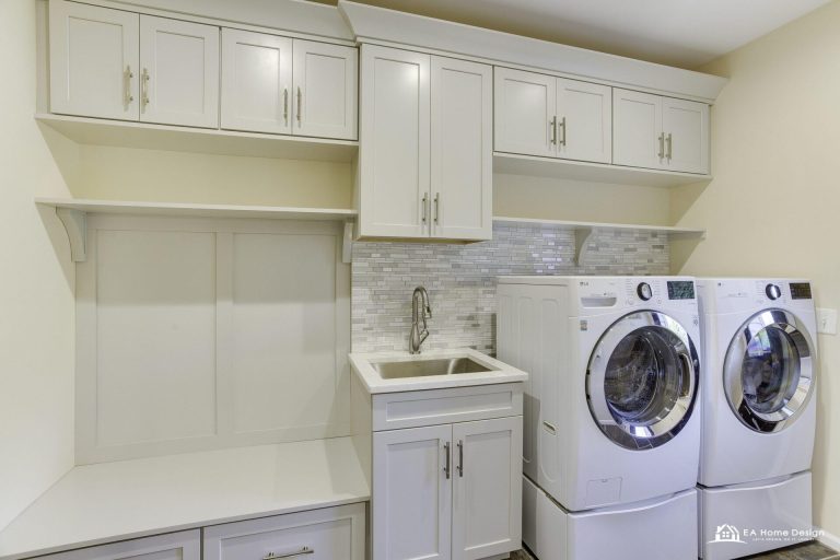 Modern kitchen with premium marble countertops, sleek cabinetry, and under-cabinet lighting.
