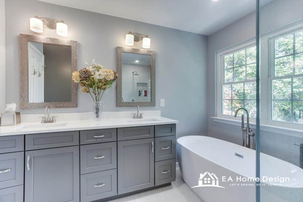 Modern bathroom upgrade highlighting premium cabinetry, a quartz countertop vanity, expansive mirrors, and layered lighting that enhances both style and function.