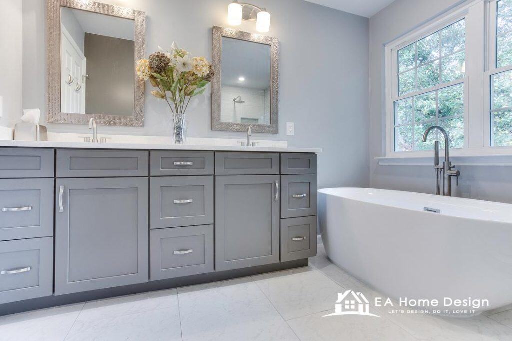 Modern bathroom upgrade highlighting premium cabinetry, a quartz countertop vanity, expansive mirrors, and layered lighting that enhances both style and function.