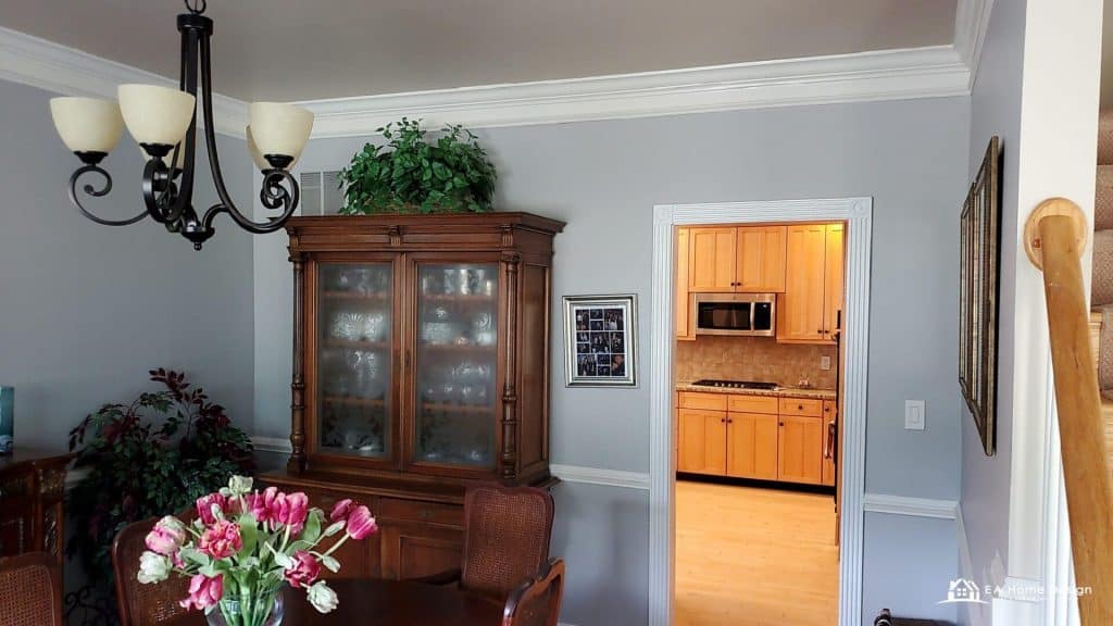 Modern kitchen with marble island, wood cabinets, and built-in appliances