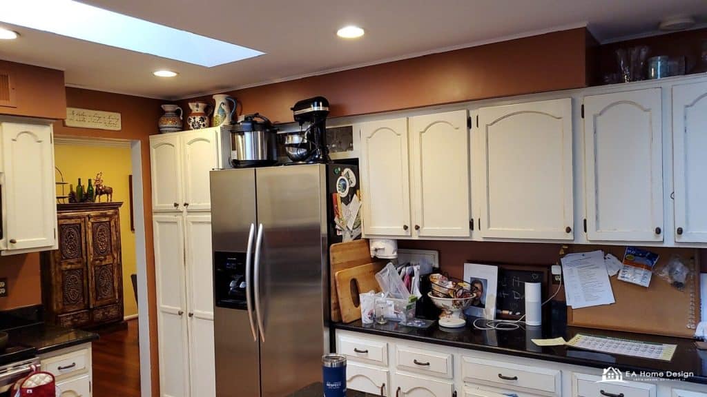 refrigerator with kitchen cabinets and countertop in a cozy home kitchen, featuring organized appliances and decor, ideal for modern home design