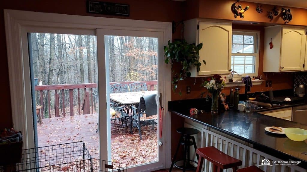 A contemporary kitchen featuring a stainless steel fridge and stove, a deep sink with exposed pipes, and beautiful pendant lights over the dining island.
