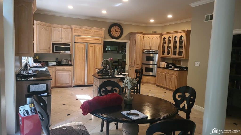 Luxurious kitchen with custom oak cabinets and stainless steel appliances for home remodeling.