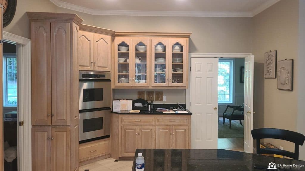 Luxurious kitchen with custom oak cabinets and stainless steel appliances for home remodeling.