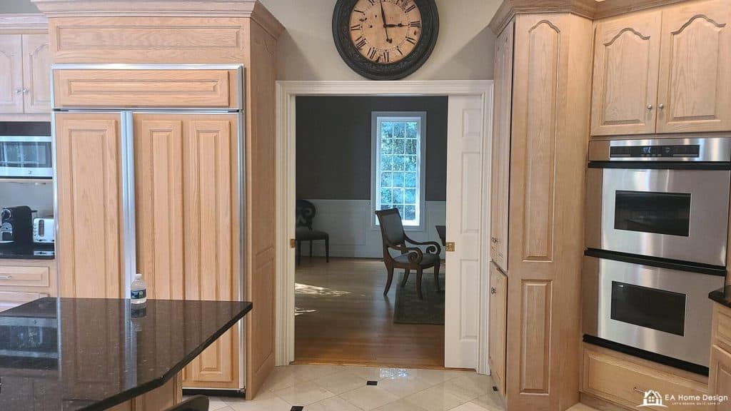 Luxurious kitchen with custom oak cabinets and stainless steel appliances for home remodeling.