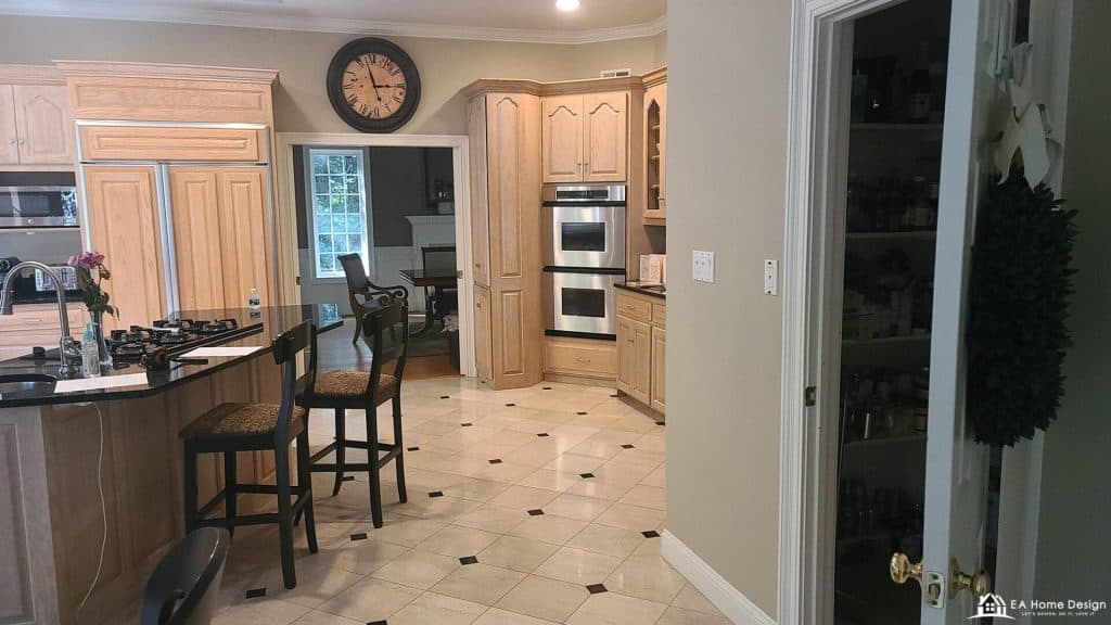 Luxurious kitchen with custom oak cabinets and stainless steel appliances for home remodeling.