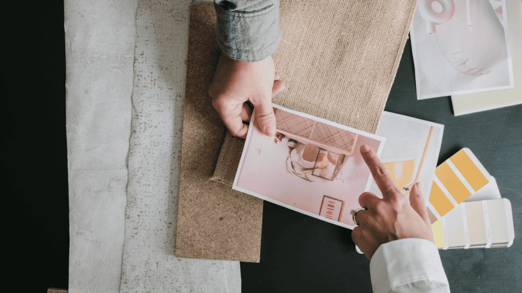 City street with cars, buildings, traffic lights, and a clear blue sky.
