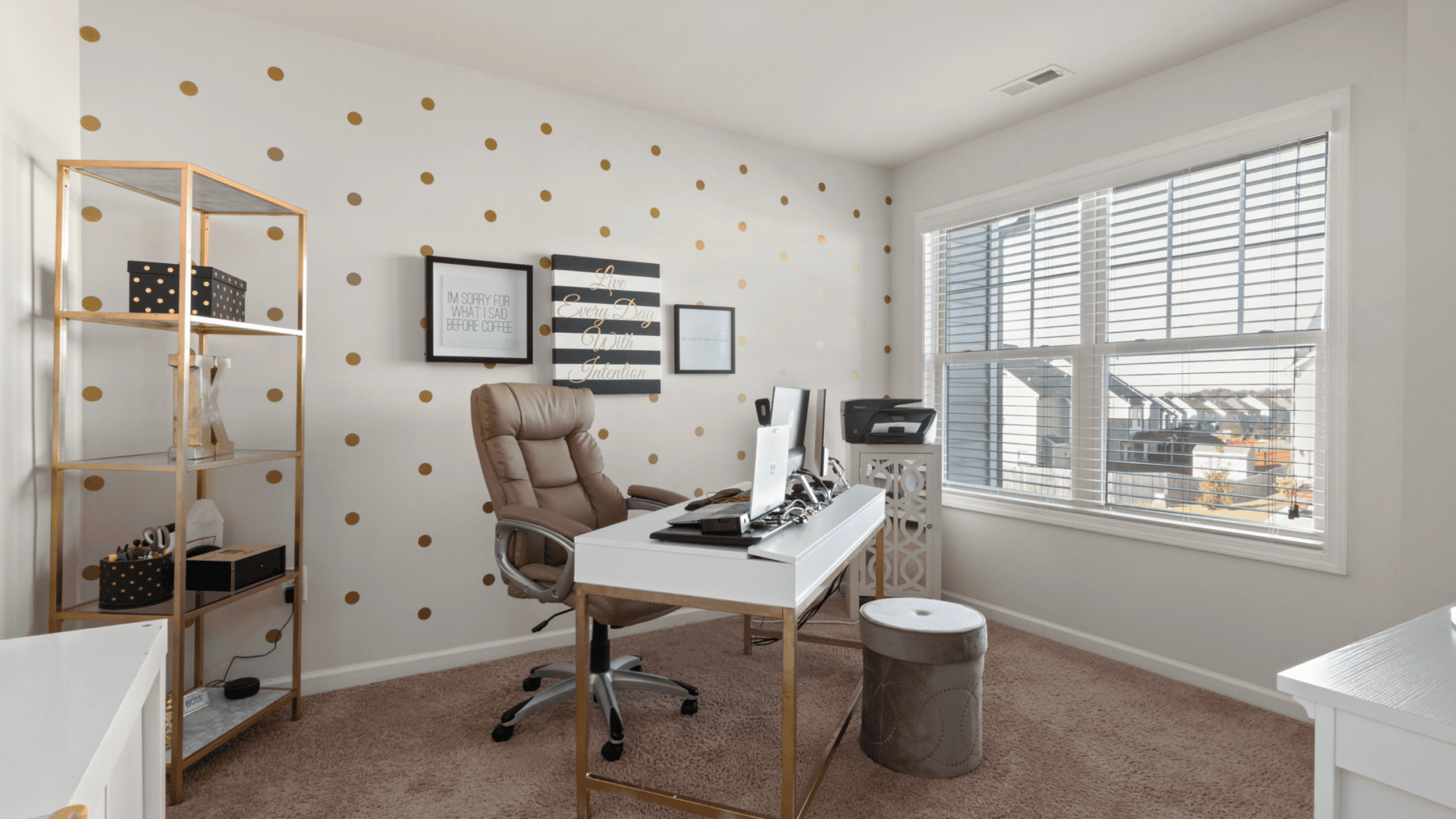 Home office with layered lighting and a calm color palette
