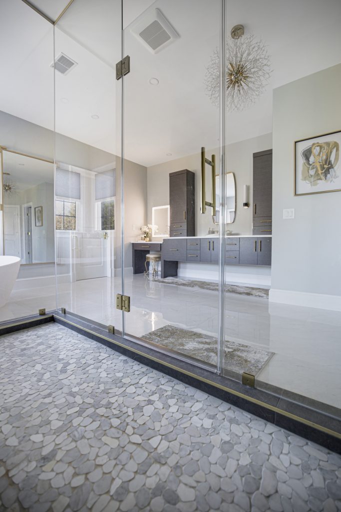 After: looking through the shower glass across the room to the vanities