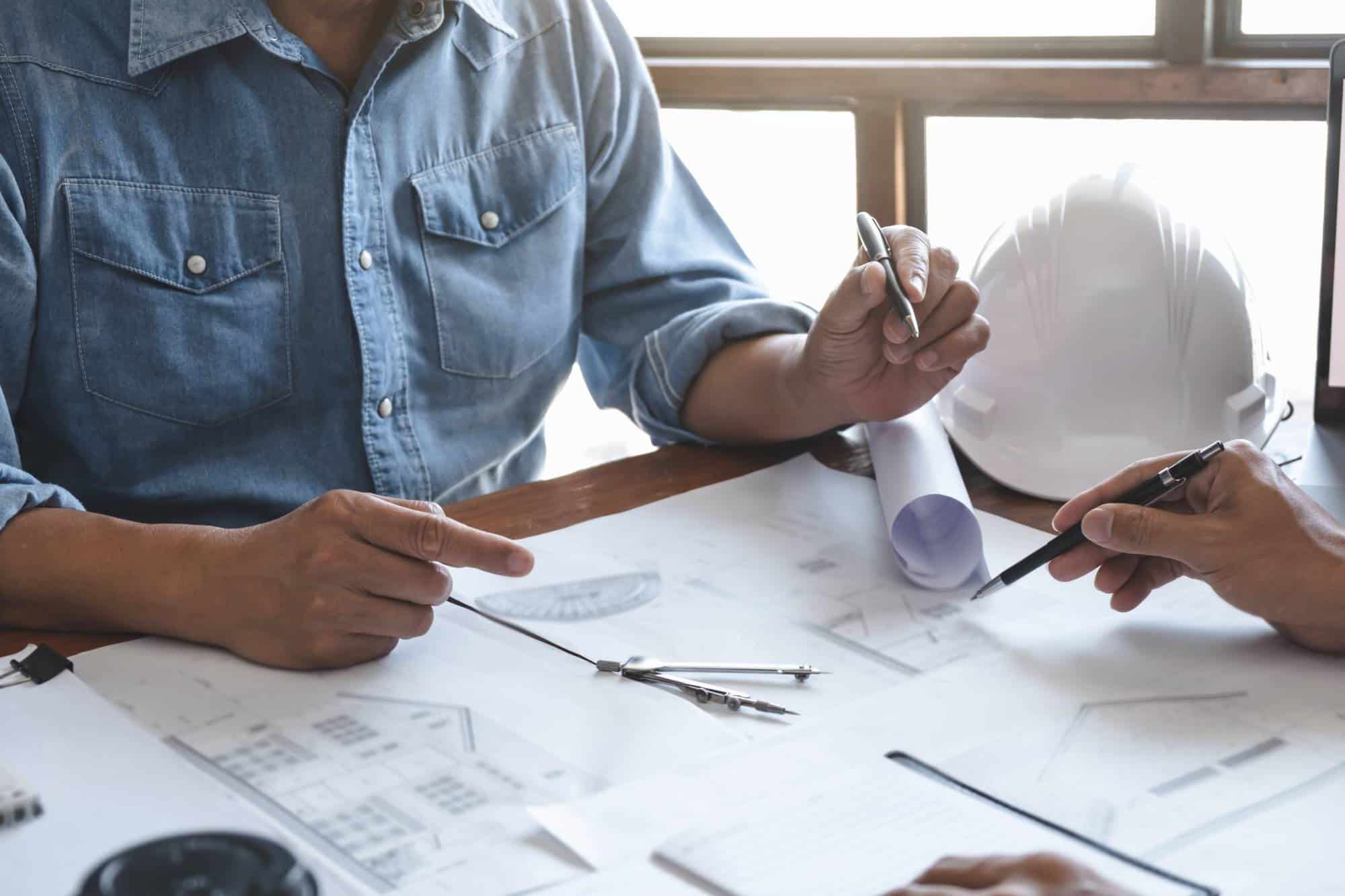 Modern home renovation interior with construction professionals inspecting new house progress