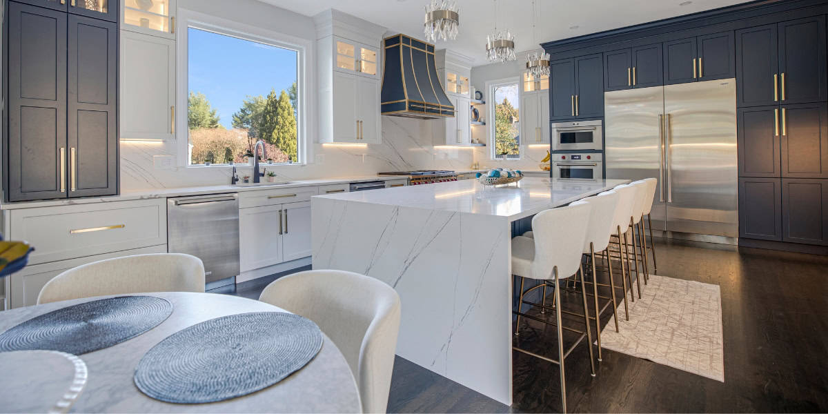 Luxurious modern kitchen with custom cabinetry, sleek appliances, and elegant marble countertops.
