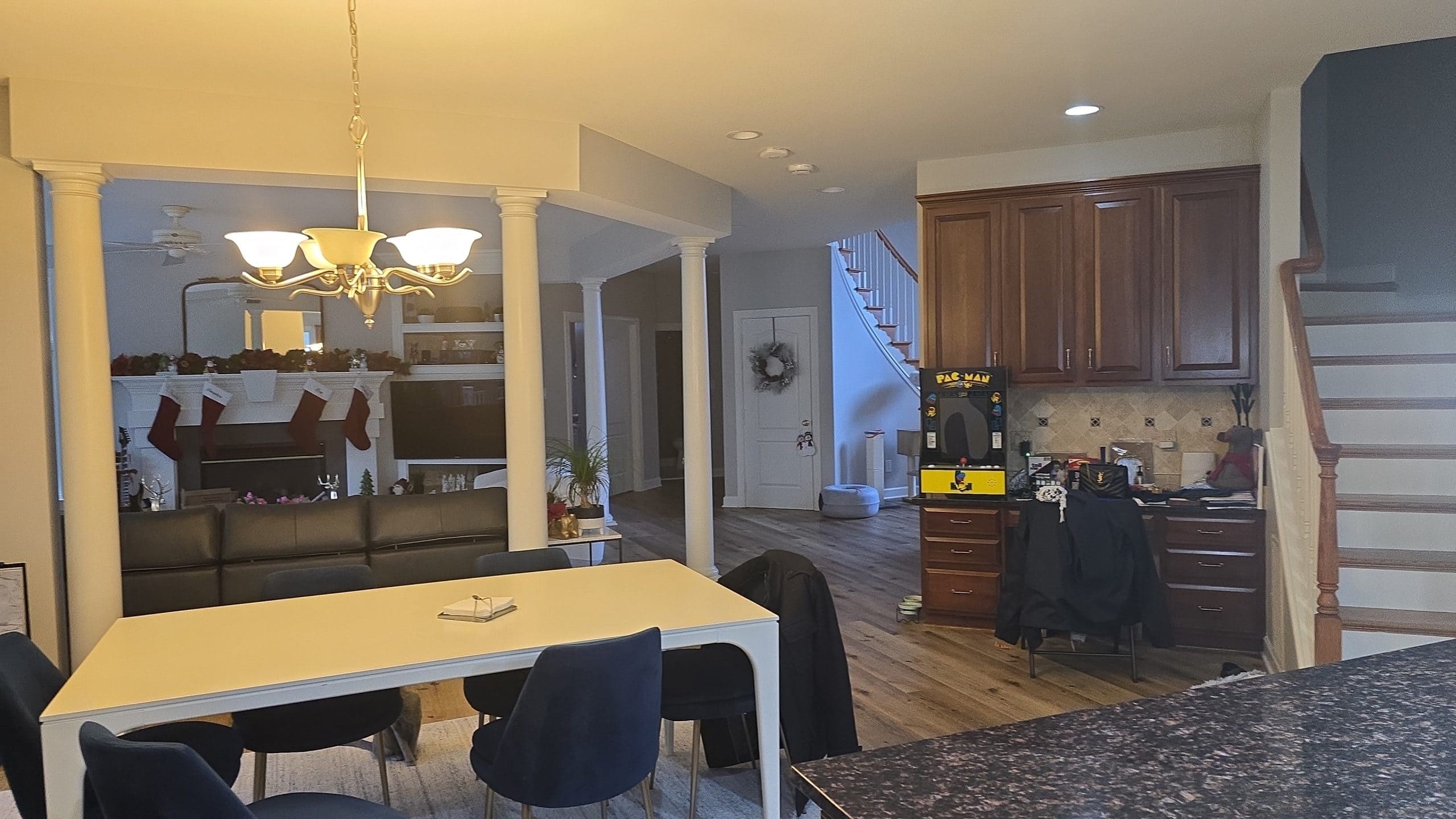 Open interior with continuous flooring flowing toward the outdoors