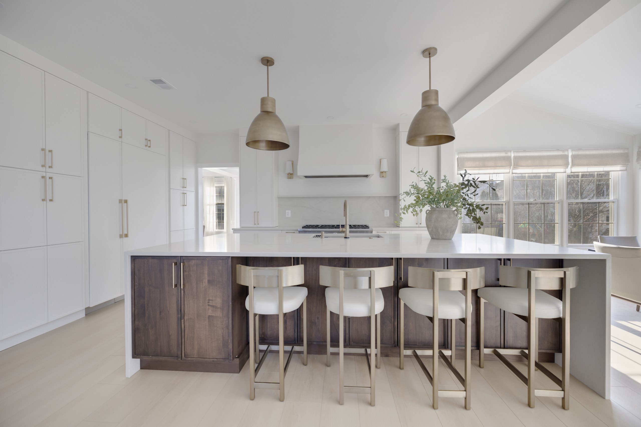 Two tone transitional kitchen with white perimeter cabinets and dark wood island in Fairfax County