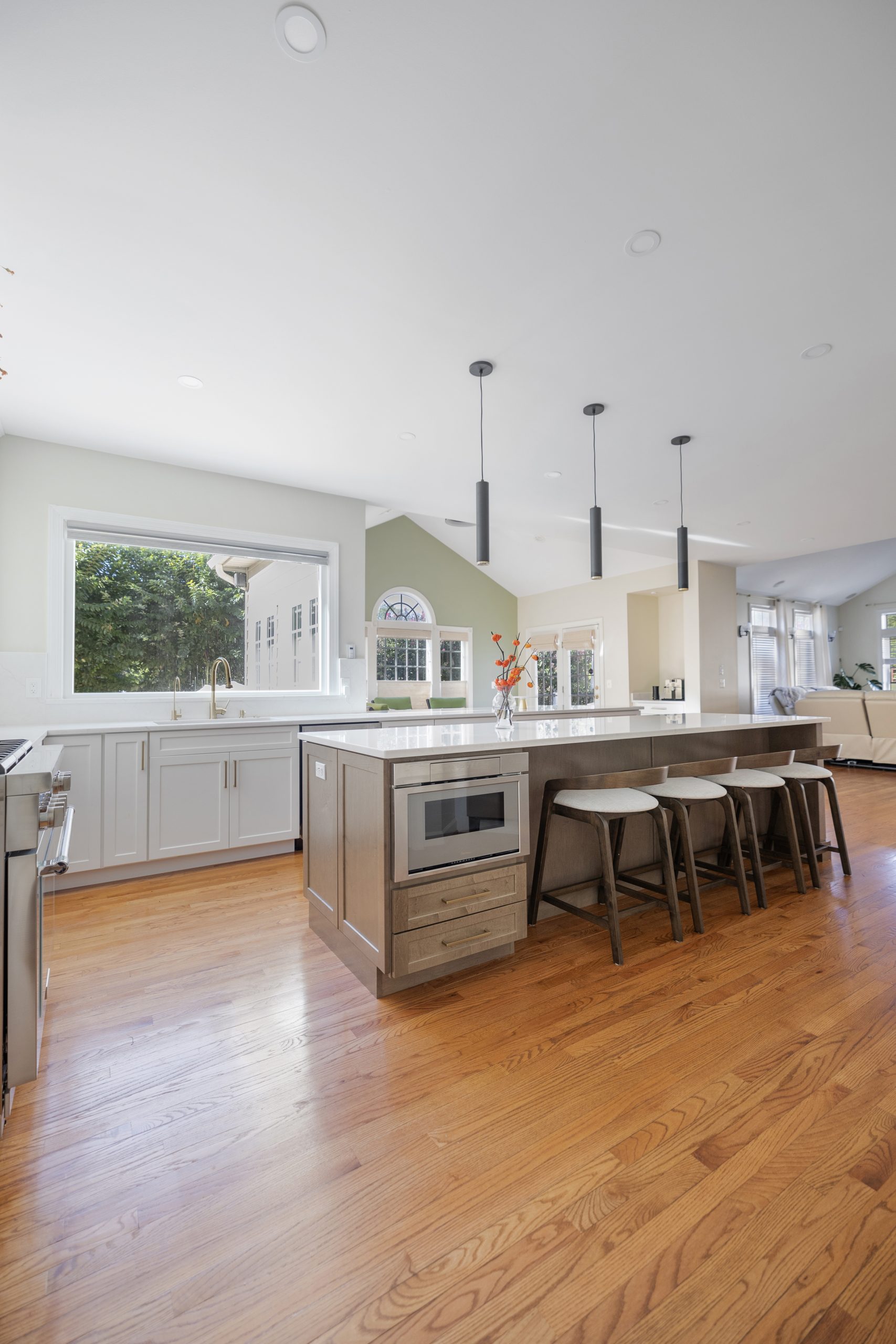 Kitchen island with built in microwave and integrated appliances in a custom Northern Virginia kitchen