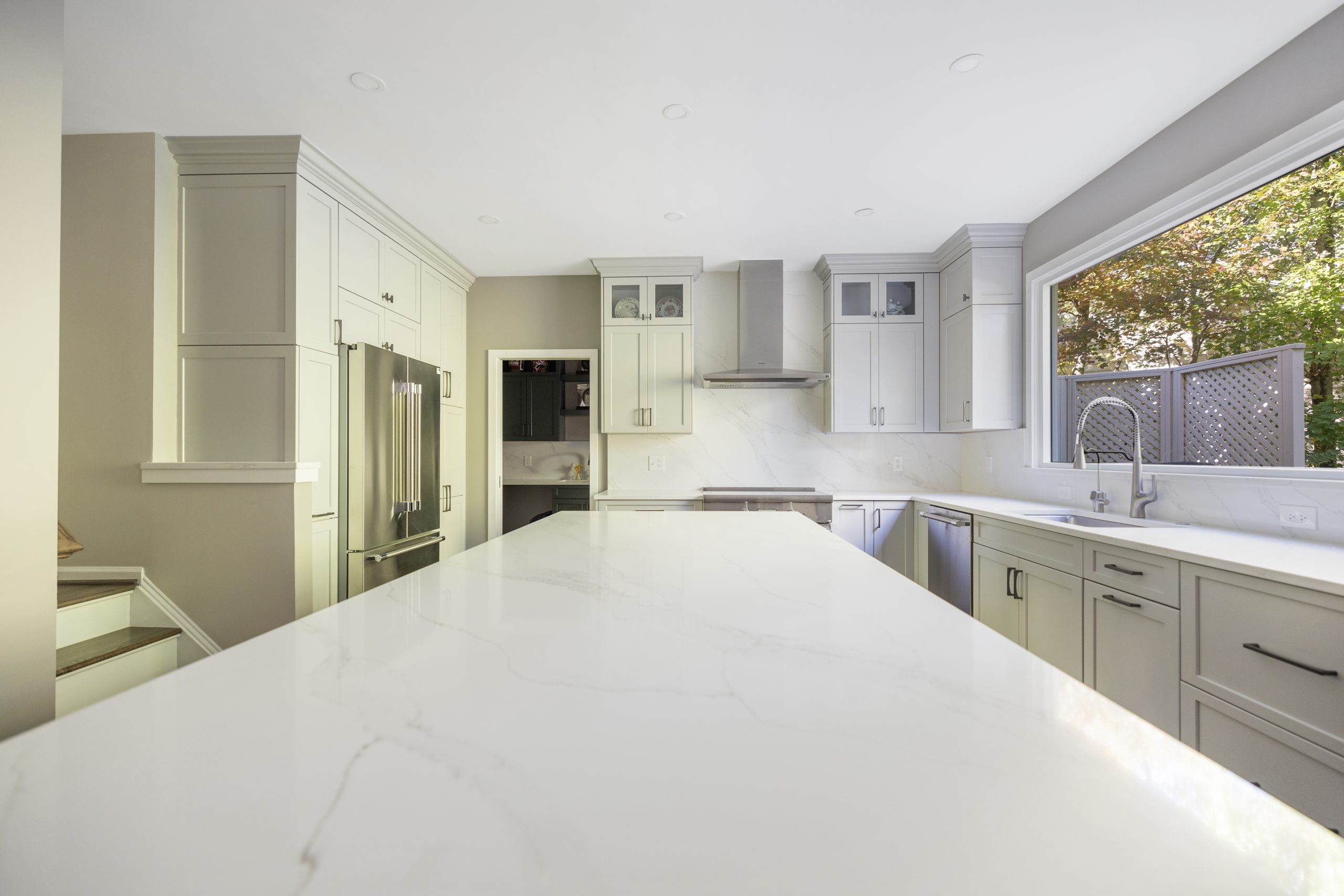 Open-concept kitchen with a large island and natural light in a Northern Virginia home