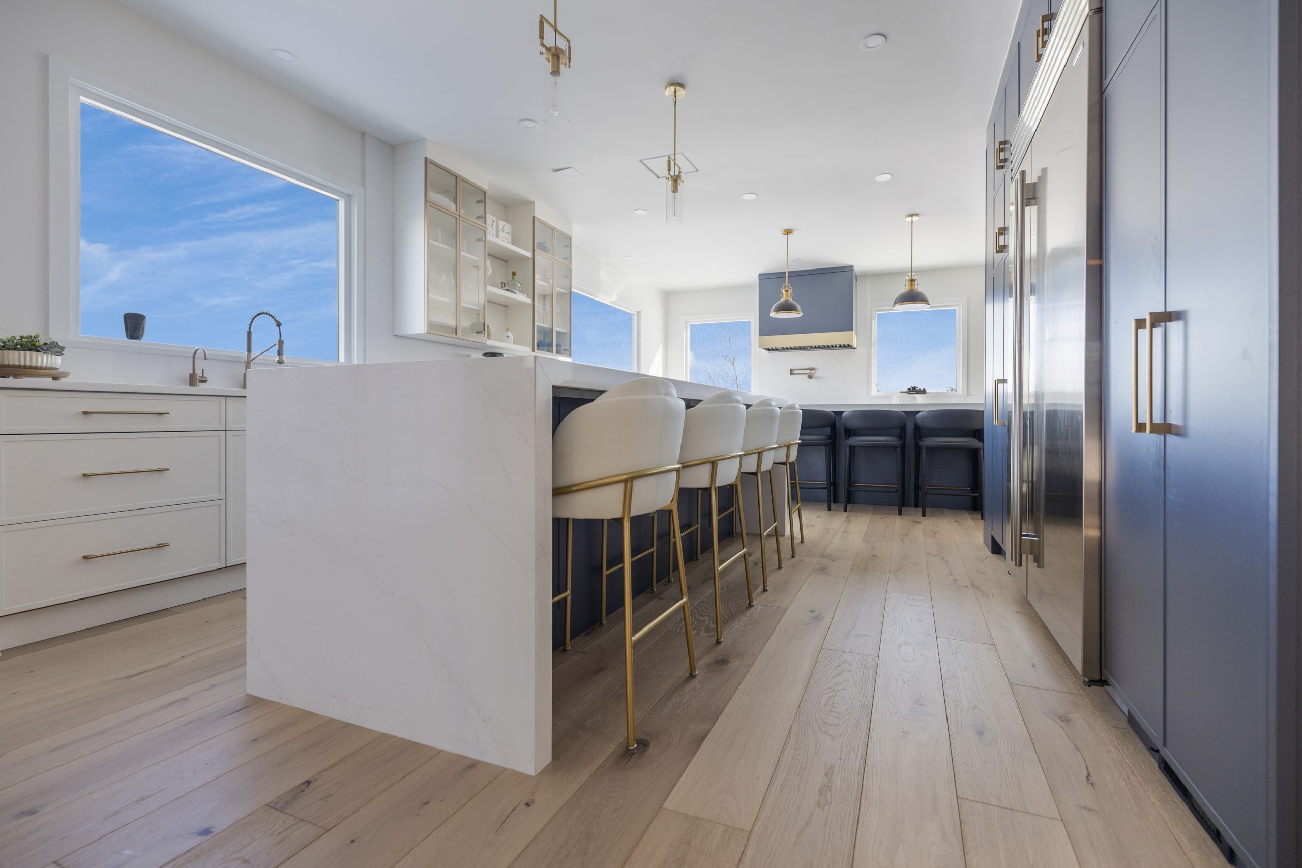 Custom kitchen cabinets with island seating and layered lighting in a Northern Virginia remodel