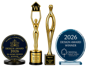 Four awards for home design are displayed: two gold trophies with stylized human figures, a circular black award with gold text, and a circular blue glass award with white text, each honoring different design achievements.