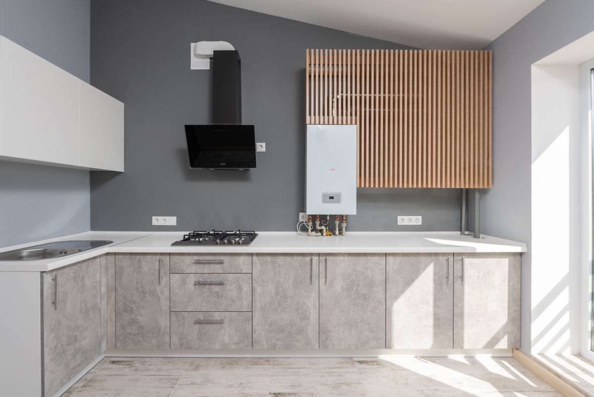 gray kitchen cabinets with white quartz countertops