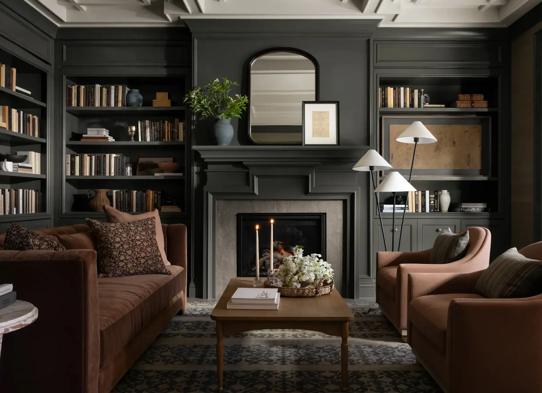 Calming deeply toned retreat room with fireplace and soft seating for home relaxation