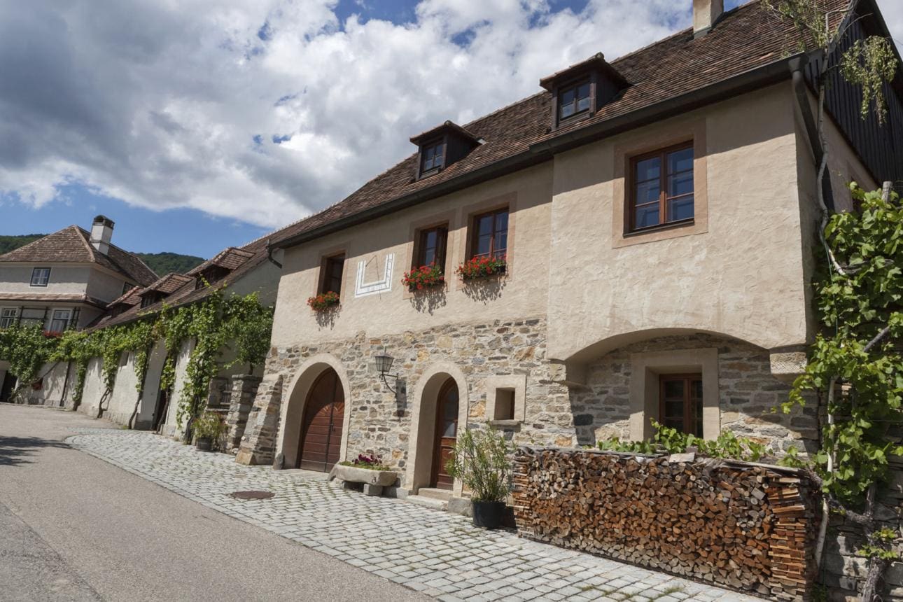 Cobblestone exterior wall with rounded historic stones