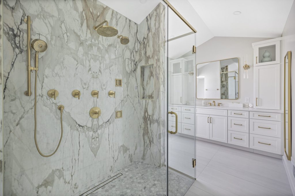 Primary bathroom remodel with marble shower showing Northern Virginia costs
