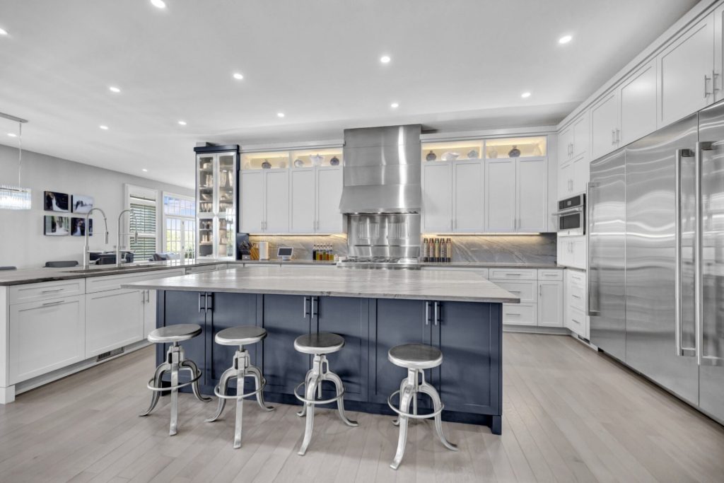After photo of a Northern Virginia kitchen remodel with white cabinets and navy island